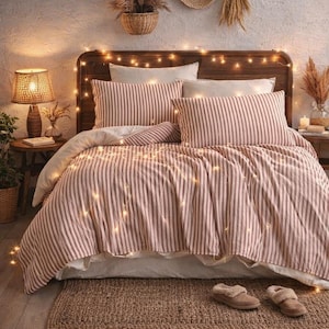Conjunto de capa de edredom listrada em tecido 100% linho orgânico.