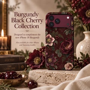 May include: A burgundy phone case featuring a floral pattern with dark red and pink flowers, green leaves, and berries. The text reads: Burgundy Black Cherry Collection, Designed to complement the new iPhone 18 Burgundy, Also available for other iPhone and Samsung models.