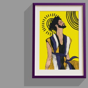 May include: A framed art print featuring a stylized illustration of a bearded person with dark hair looking upward against a bright yellow background. The figure wears a layered garment in yellow, white, and black with a tied sash, framed in purple.