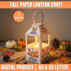 May include: A white paper lantern craft featuring fall-themed illustrations and text including Fall For Jesus, Give Thanks 1 Thess 5:18, and Jesus Is My Light. The lantern has a handle and a glowing tea light inside, with text indicating 2 sizes.