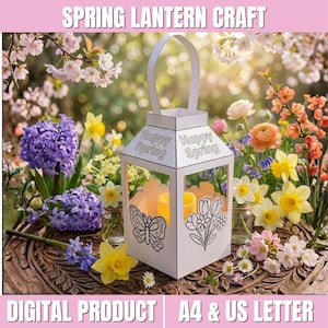 Puede incluir: Linterna de papel blanca con asa, con el texto "Happy Spring". La linterna tiene un diseño de mariposa y flores. El fondo incluye flores coloridas y el texto "Spring Lantern Craft."