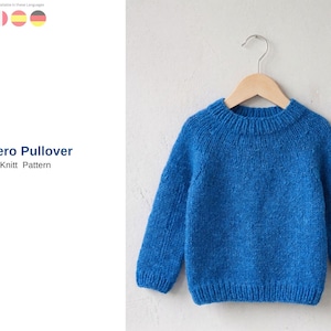 May include: A blue knitted pullover with long sleeves hangs on a wooden hanger. The sweater has a round neckline and is made of a textured yarn. The text "Cero Pullover Knit Pattern" is visible on the left side of the image.