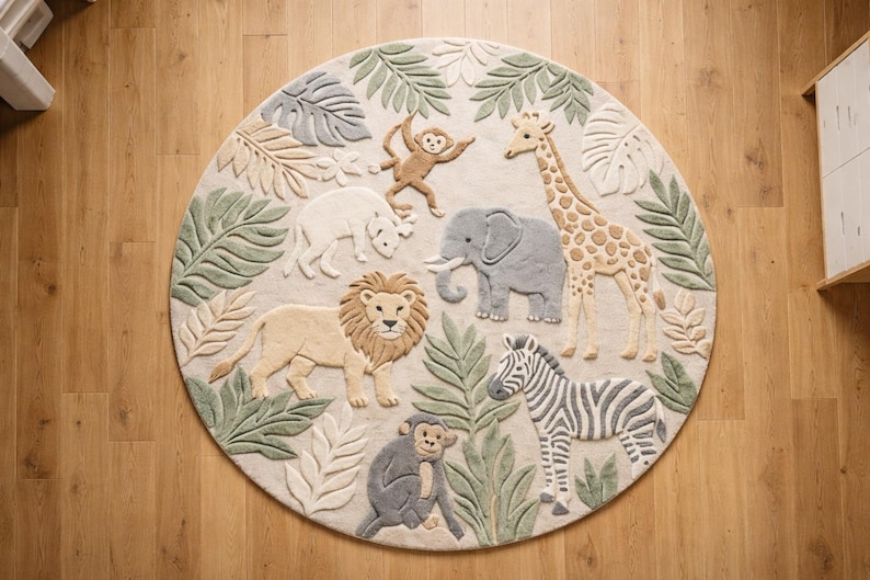 May include: A circular rug with a jungle animal design. The rug features a lion, elephant, giraffe, zebra, monkey, and rhino, surrounded by green and beige leaves. The rug is made of a soft material.