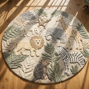 May include: A circular rug with a jungle design. The rug features raised animal figures including a lion, giraffe, zebra, elephant, monkey, and rhino, surrounded by green leaf accents. The rug is on a wooden floor.