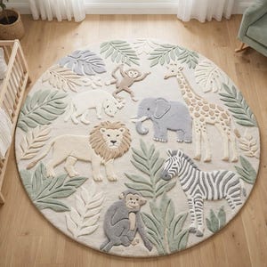 May include: A circular rug with a jungle animal design. The rug features a lion, zebra, giraffe, elephant, and monkeys, surrounded by green and beige leaves. The rug is approximately 152 cm in diameter.