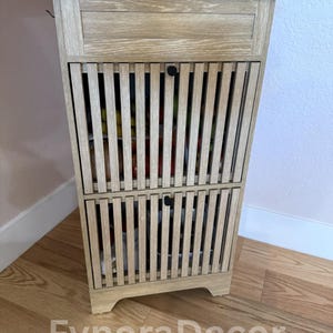 May include: A set of three ceramic mugs with a speckled, matte finish. The mugs are in shades of cream, light brown, and dark brown. Each mug has a simple, minimalist design, perfect for coffee or tea.