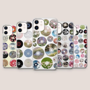 May include: Five clear phone cases with various designs featuring circular images resembling CDs. The designs include floral patterns, landscapes, and abstract art. The cases are arranged side by side, showcasing a variety of artistic styles.