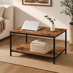 May include: A rectangular coffee table with a rustic brown wood-grain finish top and a lower shelf, supported by a black metal frame. A white laptop sits on the top surface, and a beige woven basket with a textured throw blanket rests below.