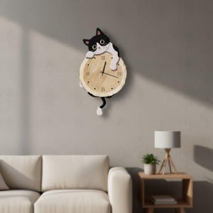 May include: A wall clock shaped like a black and white cat holding a circular wooden slice. The clock face features a light wood grain pattern with black Roman numerals for three, six, nine, and twelve, and black hour, minute, and second hands.
