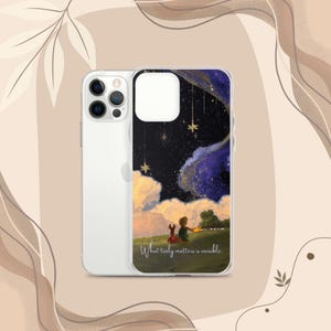 May include: Clear phone case featuring a colorful illustration from The Little Prince. The design shows a boy and a fox on a hill, under a starry night sky. The text "What truly matters is invisible" is written on the case.