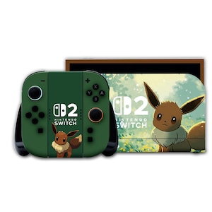Peut inclure: Une console Nintendo Switch avec une manette verte ornée d'un motif Eevee. La console porte l'inscription "Nintendo Switch" et le chiffre "2". L'écran affiche Eevee dans un cadre forestier.