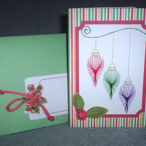 Stitched Christmas card of three ornaments.