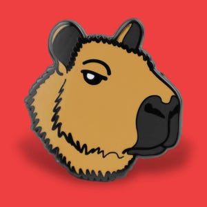 May include: A capybara enamel pin with a tan body, black nose, and black outline. The pin is set against a solid red background. The capybara's eye is a simple black dot.