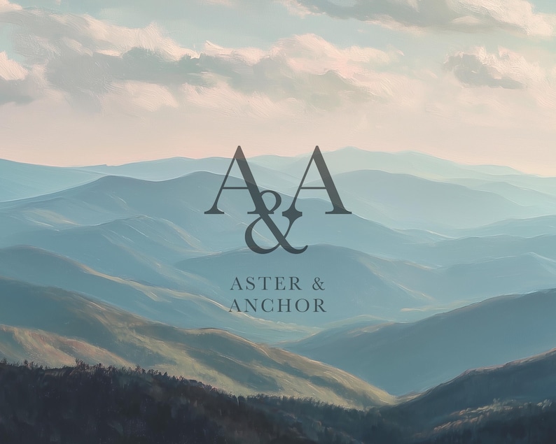 May include: A scenic landscape painting featuring layered blue mountains under a cloudy sky. The text "A & A" is above "ASTER & ANCHOR" in a dark gray font, suggesting a brand or logo.