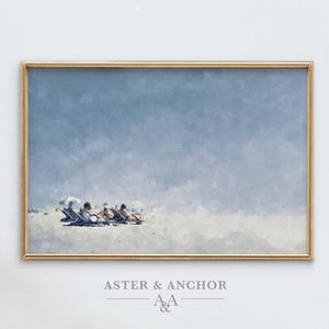 May include: A framed print featuring a beach scene with a light blue sky and a sandy beach. Several figures are lounging in beach chairs. The frame is gold, and the text "ASTER & ANCHOR" is at the bottom.