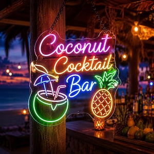May include: A neon sign with the text Coconut Cocktail Bar in pink, yellow, and blue. The sign features a green neon coconut drink with a blue umbrella and a yellow neon pineapple. It is suspended by a black chain against a wooden post.