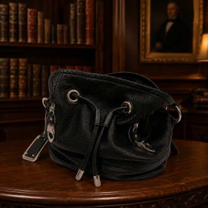 B. Makowsky Black Drawstring Leather Purse with Silver Hardware and Leopard Interior