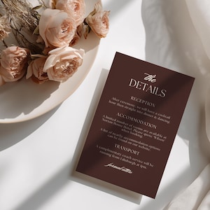Editable wedding details card template featuring reception, accommodation and transport information in a chocolate brown floral toile design.