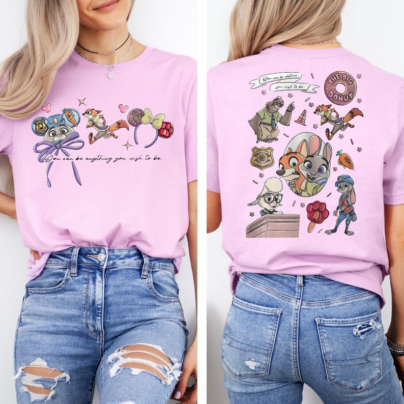 May include: A light purple t-shirt featuring Zootopia characters and icons. The front displays mouse ears and the text "You can be anything you wish to be." The back shows a collage of characters, a badge, a donut, and a carrot graphic.