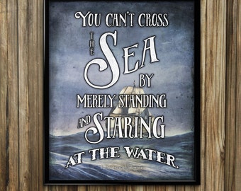 May include: A vintage-style inspirational quote about the sea, featuring a ship sailing on a stormy sea. The quote reads "You can't cross the sea merely by standing and staring at the water." - Rabindranath Tagore.