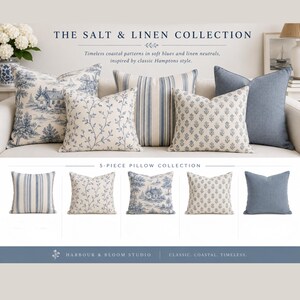 May include: A 5-piece pillow collection titled The Salt & Linen Collection featuring square cushions in blue and white patterns including toile, stripes, floral vines, and solid blue. The set is presented by Harbour & Bloom Studio.