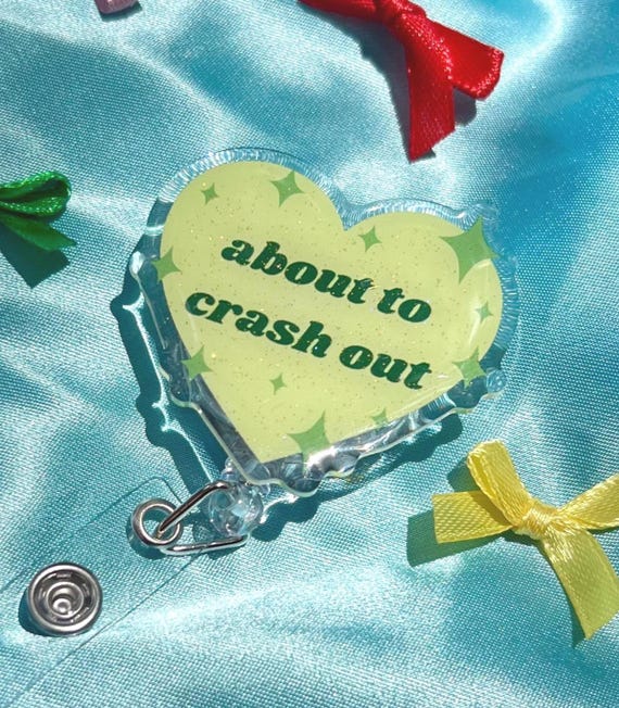 Funny Gen Z Retractable Badge Reel - "About to Crash Out" Heart Acrylic Glitter ID Holder Clip - Cute Gift for Nurses and Office Workers