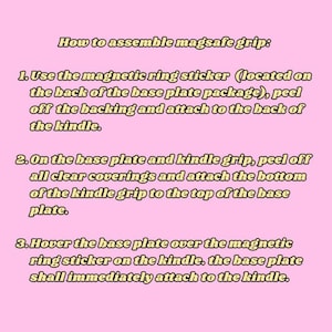 May include: Instructions on a pink background for assembling a magsafe grip. The text details three steps: applying a magnetic ring sticker, attaching the kindle grip, and hovering the base plate to attach it to the kindle.