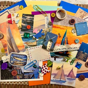 May include: A collection of nautical-themed scrapbook elements, including sailboat illustrations, puzzle pieces, buttons, and a sardine tin. The color palette includes blues, oranges, and yellows, with decorative paper and lace accents. A variety of paperclips and embellishments complete the arrangement.