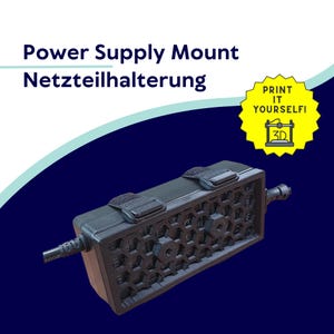 Pode incluir: Suporte de fonte de alimentação preto com design de favo de mel, duas tiras de velcro e uma ficha. O texto "Power Supply Mount Netzteilhalterung" está no topo, com um autocolante amarelo "Print It Yourself!"