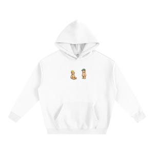May include: White hoodie with a kangaroo pocket and a drawstring hood. The front features a small graphic of two cartoon teddy bears, one wearing a crown and the other a baseball cap. The hoodie is made of a soft, comfortable material.