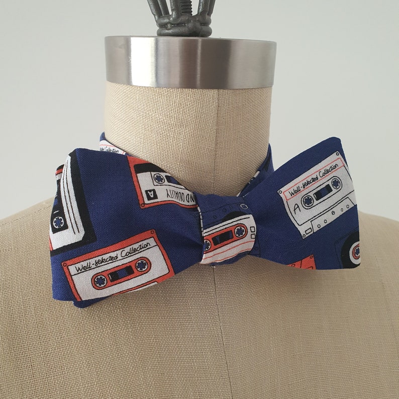 Self-tie and pre-tie bow tie cassette tapes on deep blue retro print*