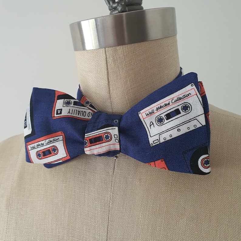Self-tie and pre-tie bow tie cassette tapes on deep blue retro print*