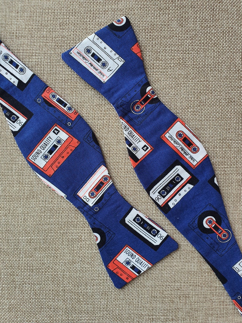 Self-tie and pre-tie bow tie cassette tapes on deep blue retro print*