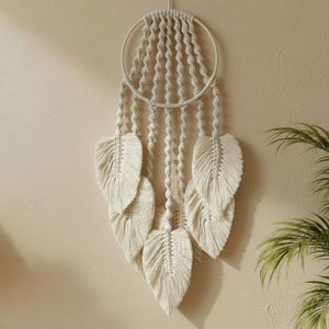 May include: A distressed wooden sign, reading "Welcome to our home" in white lettering. The sign has a rustic finish, ideal for adding a welcoming touch to any home's entrance.