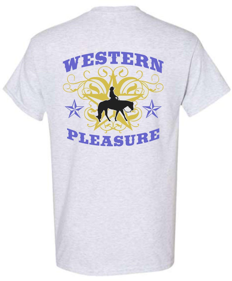 May include: Light gray t-shirt with a Western theme. The back of the shirt features the words "WESTERN PLEASURE" in blue, with a gold star and a silhouette of a person riding a horse. Two blue stars flank the central design.