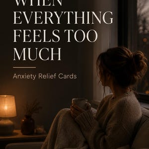 May include: A set of Anxiety Relief Cards featuring the text "WHEN EVERYTHING FEELS TOO MUCH" in large white lettering. The design includes a dark, moody background showing a person wrapped in a beige knit blanket, holding a mug near a window.