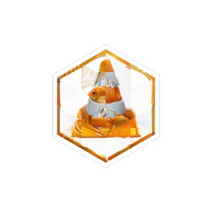 May include: A sticker featuring a goldfish inside a traffic cone. The cone is orange and white, and the fish is orange. The sticker has a hexagonal shape with an orange border and a white background.