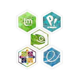 May include: Five hexagonal stickers with various designs. These include a green 'lm' logo, a blue 'P' with a white line, a green lizard, a colourful geometric pattern, and a blue 'e' with a white line. Each sticker has a white border.