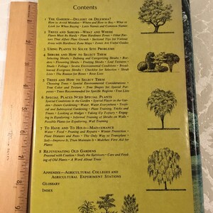 May include: A vintage book cover with a green background and a table of contents for a gardening guide. The book title is "The Garden - Delight or Dilemma?" and the chapters include "Trees and Shrubs", "Using Plants to Solve Site Problems", "Shrubs and How to Select Them", "Trees and How to Select Them", "Special Places Need Special Plants", "To Have and to Hold - Maintenance", and "Rejuvenating Old Gardens".