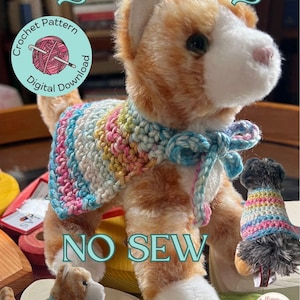 May include: A set of three ceramic mugs with a speckled, cream-colored glaze. Each mug features a different hand-painted design: a blue and green leaf, a yellow flower, and a red berry. The mugs have a simple, rounded shape.