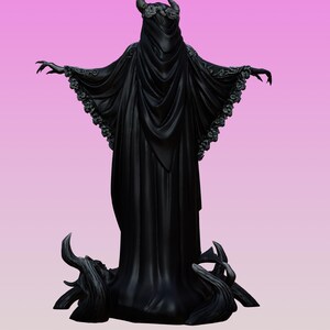 May include: A black figurine of a cloaked entity with horns and a floral crown, wearing a long, flowing robe with wide sleeves featuring intricate floral trim. The figure stands with arms outstretched, surrounded by dark, twisted root-like structures.