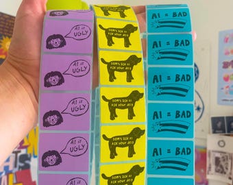 May include: Three vertical strips of rectangular stickers. The purple strip features a person with a speech bubble saying AI is UGLY. The yellow strip shows a dog silhouette with text DON'T ASK AI ASK YOUR DOG. The blue strip displays AI = BAD.