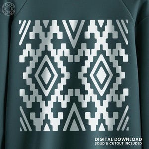 May include: A teal sweatshirt featuring a symmetrical white geometric pattern. The design includes diamond and triangular shapes. The text "DIGITAL DOWNLOAD SOLID & CUTOUT INCLUDED" is visible at the bottom right.