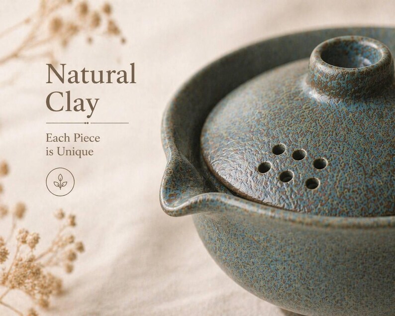 May include: A teal-colored ceramic teapot with a lid featuring multiple holes. The teapot has a textured surface and a spout. The text "Natural Clay" and "Each Piece is Unique" is visible on the left side of the image.