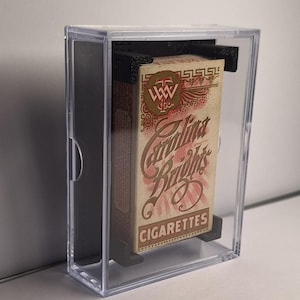 May include: A set of three ceramic mugs with a speckled, matte finish. Each mug features a different color: light blue, cream, and gray. The mugs have a simple, modern design, perfect for coffee or tea.