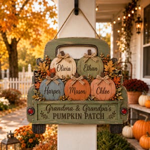 May include: A rustic green wooden truck-shaped wall sign featuring five painted pumpkins in cream, green, blue, and orange. Each pumpkin is personalized with names: Olivia, Ethan, Harper, Mason, and Chloe. The text reads Grandma & Grandpa's PUMPKIN PATCH.