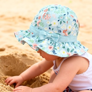 Gorro de algodón para bebé con lazo floral – Gorro tipo cubo ligero para protección solar en verano.
