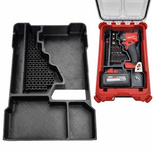 May include: Black plastic tool organizer with multiple compartments, next to a red tool case. The red case contains a red and black drill, drill bits, and a battery pack. The organizer has a honeycomb pattern.