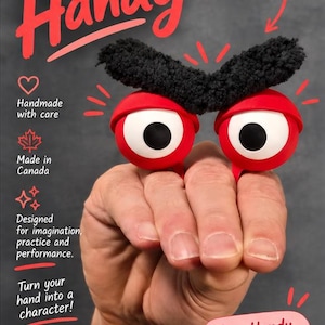 Puede incluir: Un títere de dedo con dos grandes ojos rojos esféricos, pupilas negras y cejas negras texturizadas. El texto dice: Meet Handy, Small puppet. Big personality. Endless possibilities. Handmade with care, Made in Canada, Designed for imagination, practice and performance. Turn your hand into a character! MonstersPlay, Shop Handy on Etsy, Puppets for curious creators.