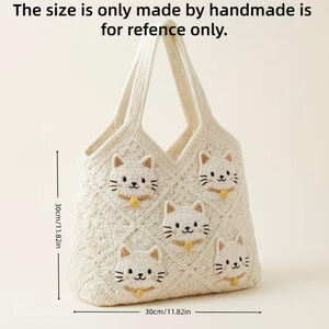 May include: Cream-colored, handmade tote bag with a cat face design. The bag is approximately 11.82 inches wide and 11.82 inches tall. The text on the image says, "The size is only made by handmade is for refence only."